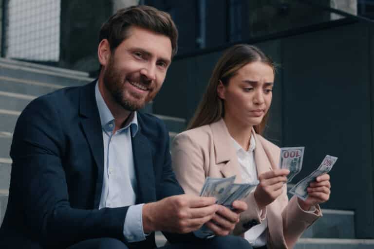 Two business man and woman in city counting money cash happy smile rich male and sad frustrated female businessman with businesswoman gender inequality financial unequal discrimination sexism at work. High quality 4k footage